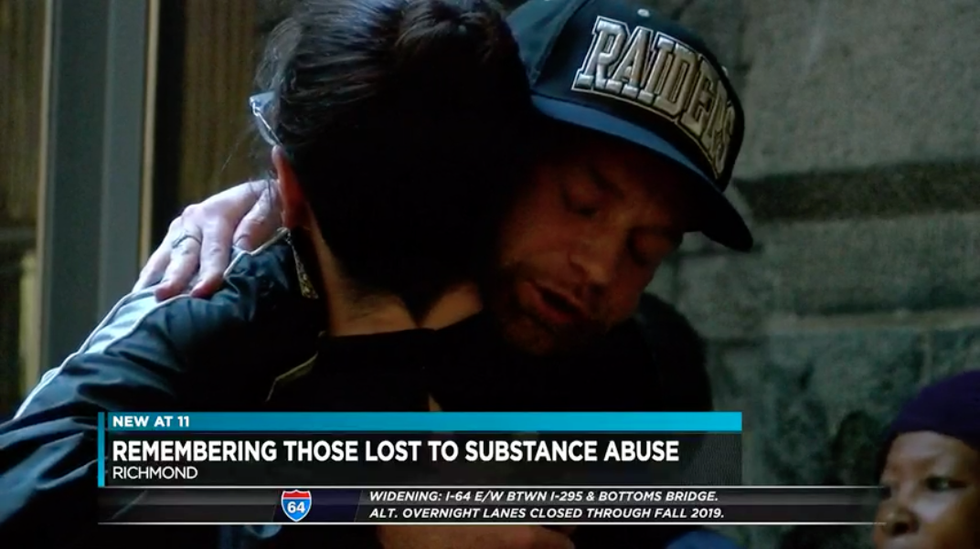 grieving man hugging woman